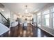 Open concept eat-in kitchen with island, white cabinets, and stainless steel appliances at 12650 Misty Ridge Ct, Fishers, IN 46037