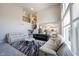 Bright living room featuring high ceilings, large windows, and modern furnishings at 12650 Misty Ridge Ct, Fishers, IN 46037
