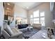Bright, open-concept living area with vaulted ceilings, large windows, and hardwood floors at 12650 Misty Ridge Ct, Fishers, IN 46037