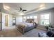 Inviting main bedroom with tray ceilings and an abundance of natural light at 12650 Misty Ridge Ct, Fishers, IN 46037