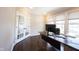 Stylish office space with natural light, French doors, and a contemporary desk at 12650 Misty Ridge Ct, Fishers, IN 46037