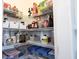 Organized walk-in pantry with wire shelving and clear storage containers for optimal kitchen storage at 12650 Misty Ridge Ct, Fishers, IN 46037