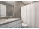 Cozy bathroom featuring neutral walls, white fixtures, and a shower curtain at 13306 Saxony W Blvd, Fishers, IN 46037