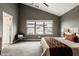 Bedroom with a neutral color palette, plush carpeting, and a large window at 13306 Saxony W Blvd, Fishers, IN 46037