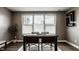 Bright dining room with a table, four chairs, and a large window at 13306 Saxony W Blvd, Fishers, IN 46037