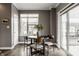 Bright dining area with a round table, modern chairs, and a sliding glass door at 13306 Saxony W Blvd, Fishers, IN 46037