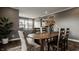 Formal dining area with hardwood flooring, a wooden table, and decor at 13306 Saxony W Blvd, Fishers, IN 46037