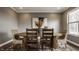 Dining room features hardwood flooring, a wooden table, and natural light at 13306 Saxony W Blvd, Fishers, IN 46037