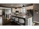 Bright kitchen featuring a large island with seating, stainless steel appliances, and ample counter space at 13306 Saxony W Blvd, Fishers, IN 46037
