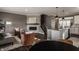 Inviting open-concept living space with a fireplace, modern furnishings, and hardwood floors at 13306 Saxony W Blvd, Fishers, IN 46037