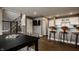 Open concept living room featuring an open kitchen, staircase, and a tv at 13306 Saxony W Blvd, Fishers, IN 46037