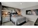 Modern bedroom with a football theme decor, large window, and comfortable furnishings at 15372 Hurst Rd, Fishers, IN 46040
