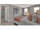 Bright bedroom with lots of light, featuring cozy decor and ample closet space at 15372 Hurst Rd, Fishers, IN 46040