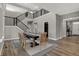 Spacious dining area featuring an open floor plan, modern staircase, and elegant decor, ideal for gatherings at 15372 Hurst Rd, Fishers, IN 46040