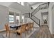 Elegant dining room featuring a soaring ceiling, modern decor, and natural light from expansive windows at 15372 Hurst Rd, Fishers, IN 46040