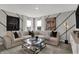 Inviting living room with a comfortable sectional, modern decor, and ample natural light creating a cozy atmosphere at 15372 Hurst Rd, Fishers, IN 46040