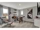 Bright home office with large windows and decorative shelving, bathed in natural light at 15372 Hurst Rd, Fishers, IN 46040