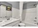 This bathroom features a shower-tub combo and white subway tile at 16917 Sandhurst Pl, Westfield, IN 46074