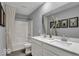 Elegant bathroom with a double vanity, quartz countertop, and well-lit mirror offering a spa-like experience at 16917 Sandhurst Pl, Westfield, IN 46074