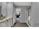 Tastefully designed bathroom with a modern vanity, mirror, and shower with bedroom views in the background at 16917 Sandhurst Pl, Westfield, IN 46074