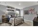 Cozy bedroom with themed decor, decorative shelving, and ample natural light, creating a playful atmosphere at 16917 Sandhurst Pl, Westfield, IN 46074