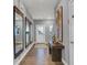 Inviting entryway boasts hardwood floors, decorative mirrors, console table, and neutral paint at 16917 Sandhurst Pl, Westfield, IN 46074