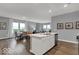Kitchen island with a view of a dining area and living area at 16917 Sandhurst Pl, Westfield, IN 46074