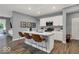 A spacious kitchen with white cabinets, a center island and stainless steel appliances at 16917 Sandhurst Pl, Westfield, IN 46074