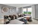 This living room features a large sectional sofa, and bright natural lighting at 16917 Sandhurst Pl, Westfield, IN 46074