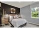 A beautifully decorated bedroom with neutral tones and a large window at 16917 Sandhurst Pl, Westfield, IN 46074