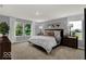 This main bedroom has bright windows and neutral-colored walls at 16917 Sandhurst Pl, Westfield, IN 46074