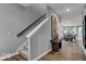 Open staircase leads to an open-concept living area, seamlessly blending comfort and style at 16917 Sandhurst Pl, Westfield, IN 46074