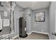 Well-kept utility room featuring new water heater, furnace, and tile flooring at 16917 Sandhurst Pl, Westfield, IN 46074