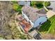 An aerial view showcases the backyard with a deck, fire pit, lush lawn, and storage shed at 17420 Dalton Ct, Noblesville, IN 46062