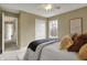 Relaxing bedroom featuring a large window and closet at 17420 Dalton Ct, Noblesville, IN 46062