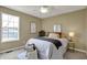 Cozy bedroom featuring a large window and a variety of decorative pillows at 17420 Dalton Ct, Noblesville, IN 46062