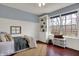 Comfortable bedroom with large windows, built in bookshelf, and stylish decor at 17420 Dalton Ct, Noblesville, IN 46062