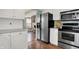 Updated kitchen with stainless steel refrigerator and appliances, and views to the living area at 17420 Dalton Ct, Noblesville, IN 46062