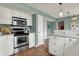 Modern kitchen features stainless steel appliances and ample cabinet space at 17420 Dalton Ct, Noblesville, IN 46062