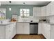 Sunlit kitchen with white cabinets, stainless steel appliances, and an eat-in bar area at 17420 Dalton Ct, Noblesville, IN 46062