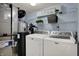 Laundry area featuring new washer and dryer and overhead storage at 17420 Dalton Ct, Noblesville, IN 46062