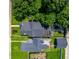 Aerial view of home showcasing roof deck, backyard, and landscaping in a quiet neighborhood at 1818 N Cornell Ave, Indianapolis, IN 46202