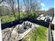 Inviting backyard with a fire pit, seating area, and privacy fence, ideal for outdoor entertaining at 1818 N Cornell Ave, Indianapolis, IN 46202