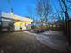 Inviting backyard with a patio, string lights, a cozy fire pit area, and a wooden fence for privacy at 1818 N Cornell Ave, Indianapolis, IN 46202