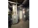 Utility area of basement with furnace, water heater, and some storage shelving at 1818 N Cornell Ave, Indianapolis, IN 46202