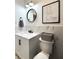 Bathroom featuring modern vanity, matte black hardware, and decorative accents at 1818 N Cornell Ave, Indianapolis, IN 46202