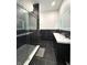 Elegant bathroom with a glass-enclosed shower and double vanity sinks at 1818 N Cornell Ave, Indianapolis, IN 46202