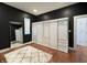 Cozy bedroom with sleek wardrobe closet, neutral rug, and ample natural light at 1818 N Cornell Ave, Indianapolis, IN 46202