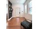 Bright entryway with wood floors, accent wall, and modern decor at 1818 N Cornell Ave, Indianapolis, IN 46202