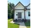 Charming front porch with craftsman details, modern door, and inviting curb appeal at 1818 N Cornell Ave, Indianapolis, IN 46202